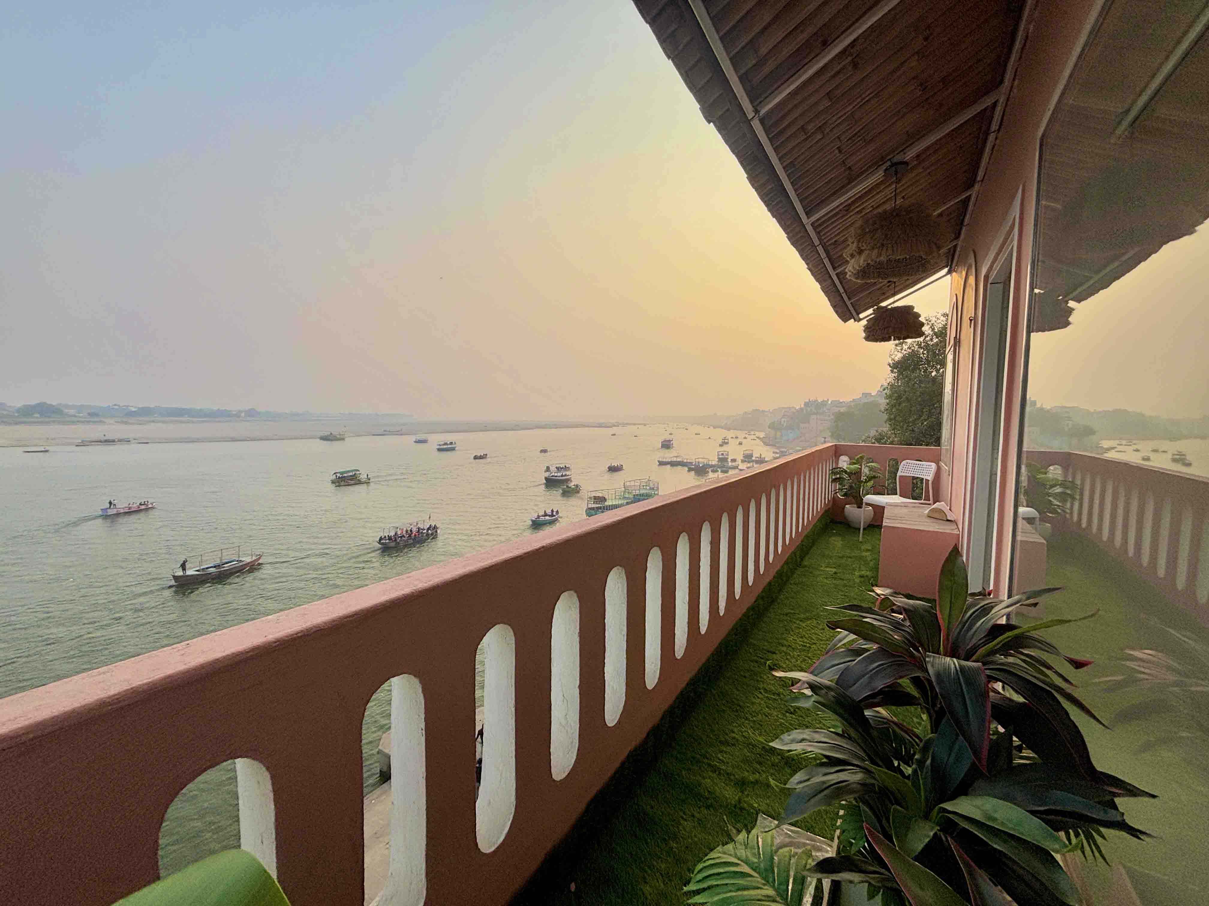 Vintage River Homestay balcony facing the holy Ganges River at dusk